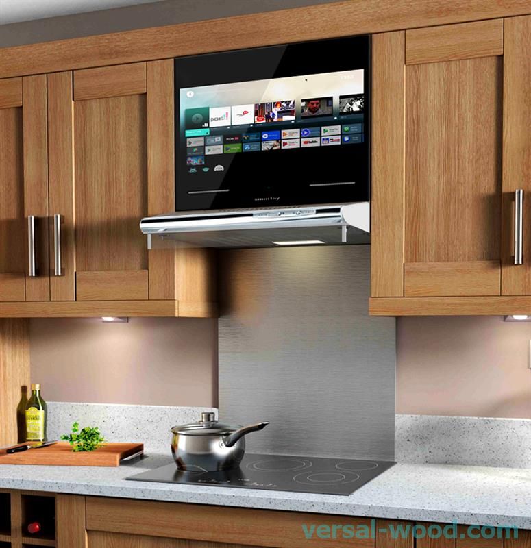 Телевізор вбудований в фасад кухні - зручний і популярний варіант